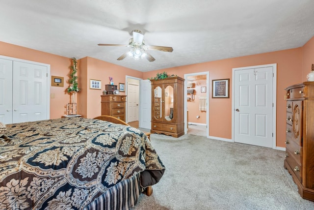 bedroom with baseboards, carpet floors, a textured ceiling, and ceiling fan