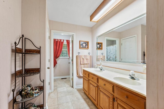 bathroom featuring vanity and tile patterned flooring