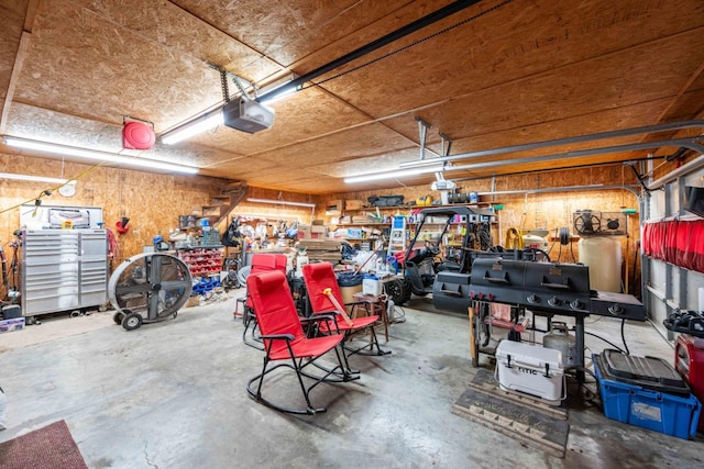 garage featuring a workshop area and a garage door opener