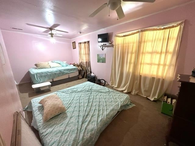 bedroom featuring ceiling fan and carpet floors