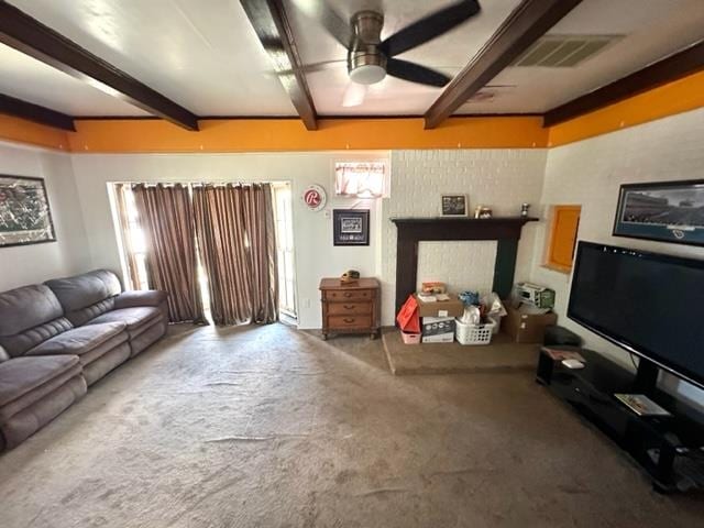 living room featuring beam ceiling and ceiling fan