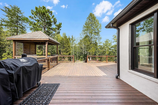 wooden terrace with a gazebo and grilling area