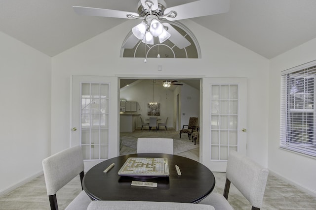 dining room with french doors, a ceiling fan, and vaulted ceiling