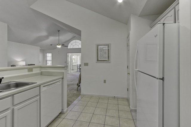 kitchen featuring ceiling fan, lofted ceiling, white cabinets, white appliances, and a sink