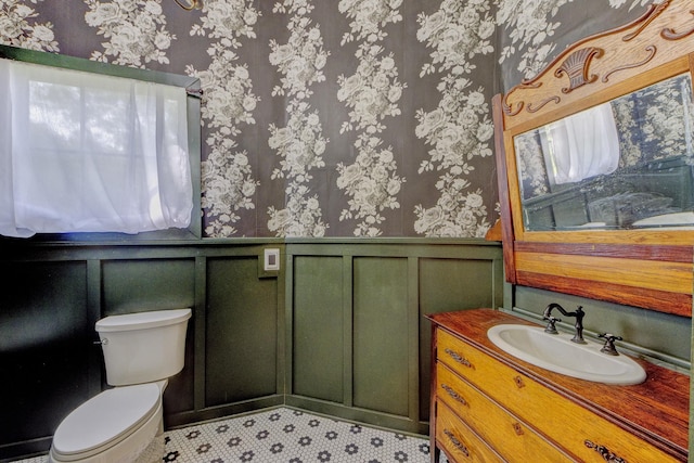 bathroom featuring toilet and vanity