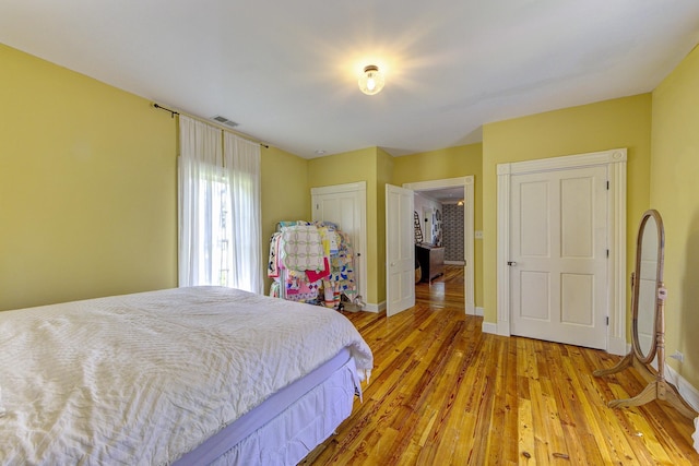 bedroom with light hardwood / wood-style flooring