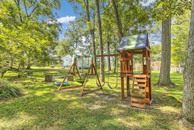 view of playground with a lawn