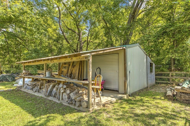 view of outbuilding featuring a lawn