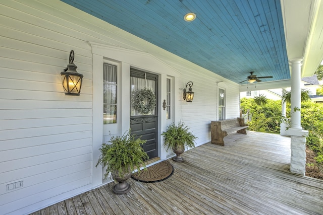 wooden terrace featuring a porch and ceiling fan