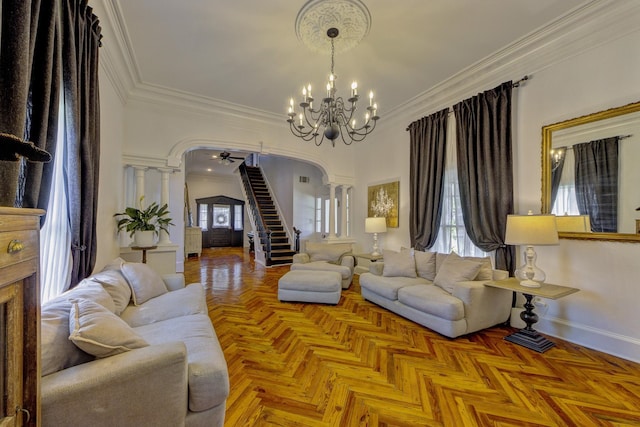 living room featuring crown molding, parquet flooring, and decorative columns