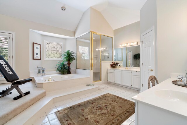 bathroom featuring lofted ceiling, tile patterned floors, separate shower and tub, and vanity