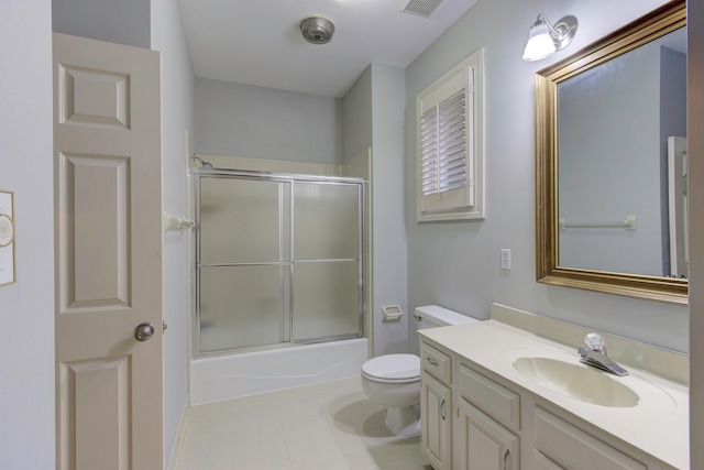 full bathroom with tile patterned flooring, toilet, combined bath / shower with glass door, and vanity