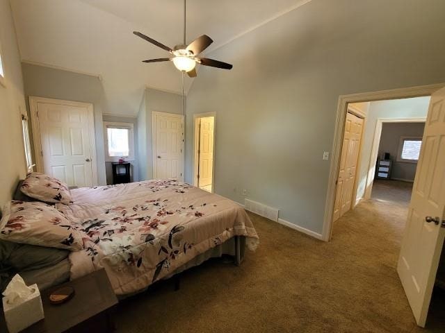 bedroom with high vaulted ceiling, ceiling fan, and carpet flooring