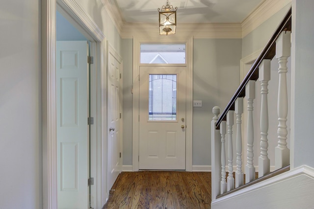 foyer with ornamental molding, plenty of natural light, and dark hardwood / wood-style floors