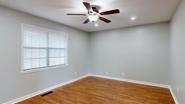 unfurnished room featuring hardwood / wood-style flooring and ceiling fan