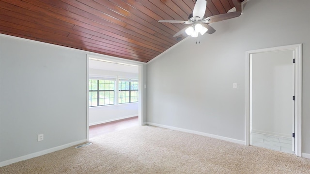 spare room with wood ceiling, lofted ceiling, ceiling fan, and carpet