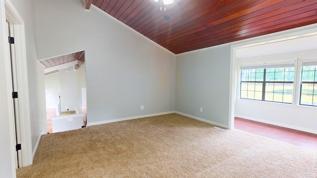 unfurnished room featuring lofted ceiling, wood ceiling, and carpet