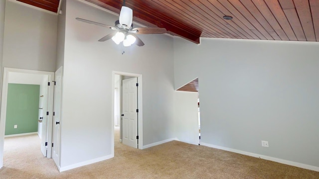 unfurnished bedroom featuring light colored carpet, ceiling fan, high vaulted ceiling, and wooden ceiling