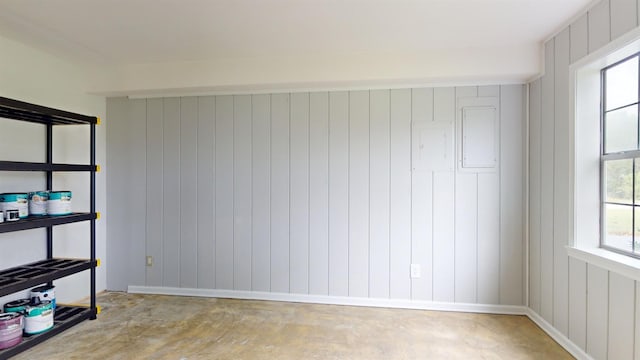 empty room with concrete flooring