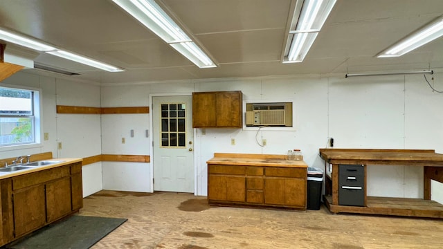 kitchen with sink and a wall mounted air conditioner