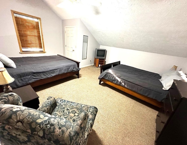 carpeted bedroom with a textured ceiling, ceiling fan, and lofted ceiling