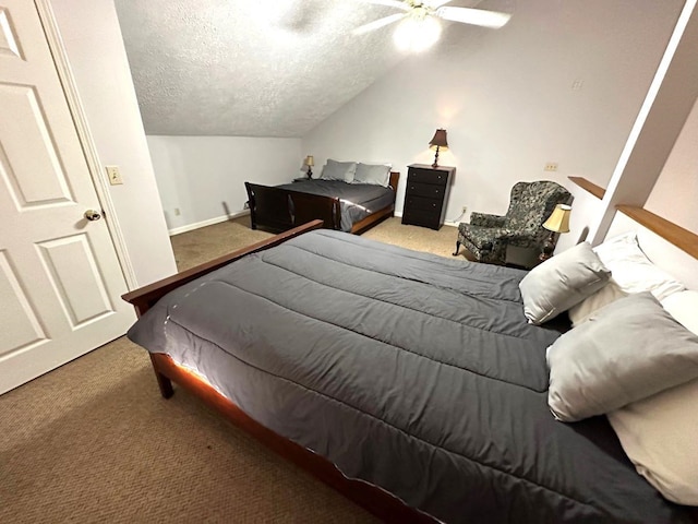 bedroom featuring a textured ceiling, carpet flooring, vaulted ceiling, and ceiling fan