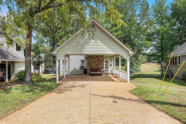 180 Vantage Pt, Counce, TN 38326 - bungalow-style home with a carport, concrete driveway, and a front yard