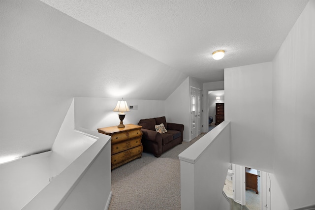180 Vantage Pt, Counce, TN 38326 - hall featuring carpet, vaulted ceiling, an upstairs landing, and a textured ceiling