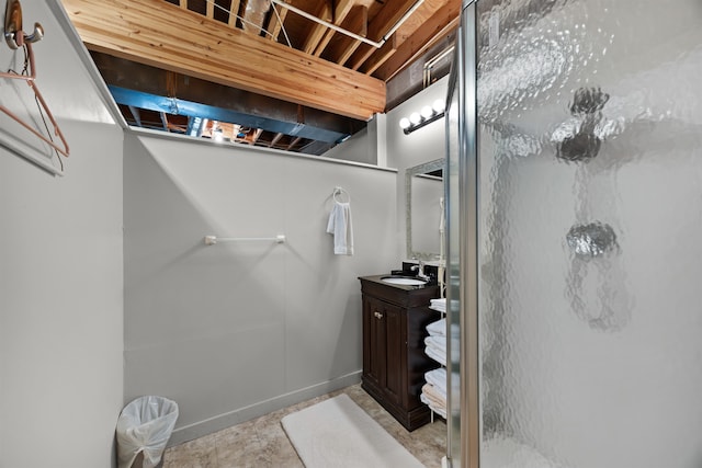 bathroom featuring vanity and a shower with shower door