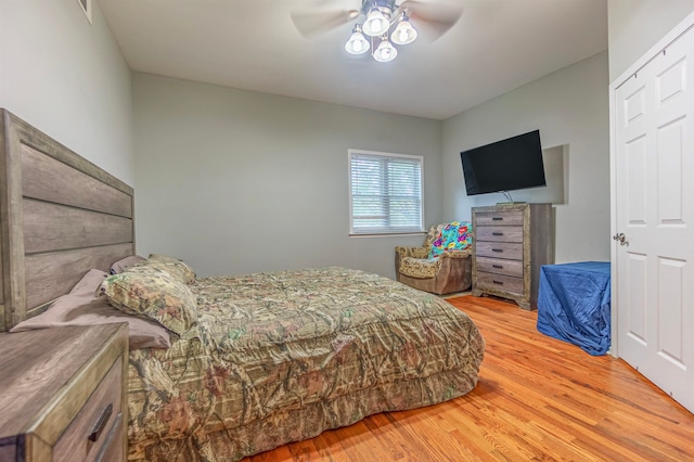 bedroom featuring ceiling fan and light hardwood / wood-style flooring