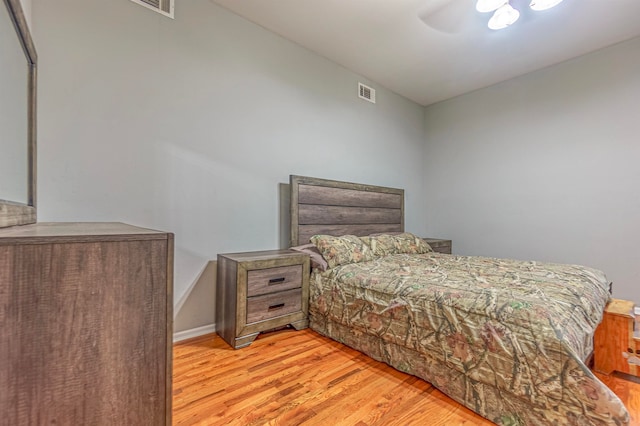 bedroom featuring ceiling fan and light hardwood / wood-style floors