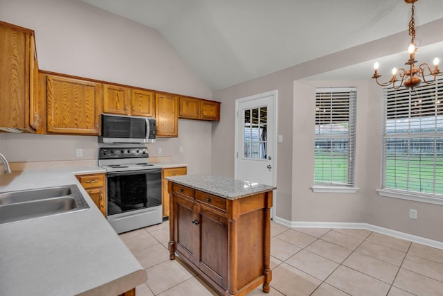 kitchen with vaulted ceiling, light tile patterned floors, white electric stove, an inviting chandelier, and decorative light fixtures