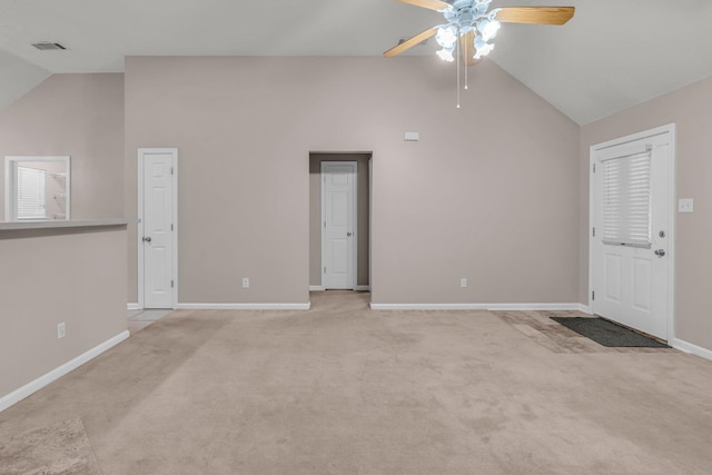 unfurnished living room with ceiling fan, light colored carpet, and lofted ceiling