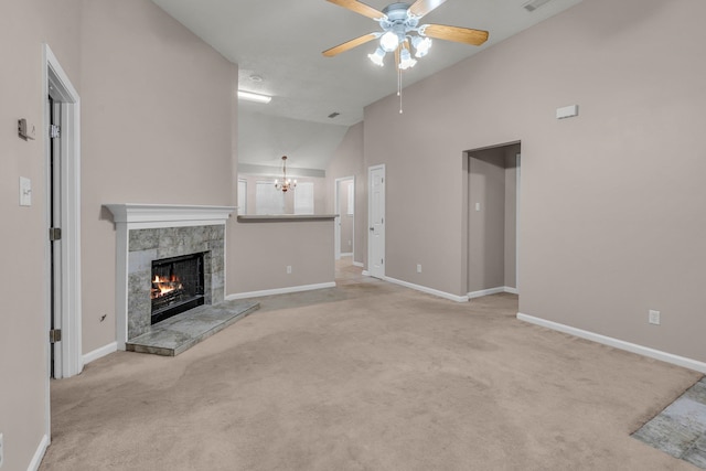 unfurnished living room with light colored carpet, ceiling fan with notable chandelier, a fireplace, and high vaulted ceiling