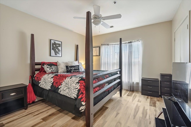 bedroom with light wood-type flooring and ceiling fan