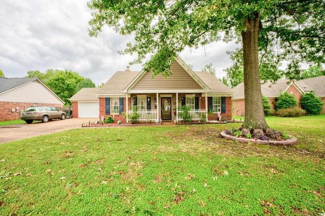 view of front of home with a porch, a garage, and a front yard