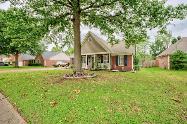 view of front of home with a front yard and a porch