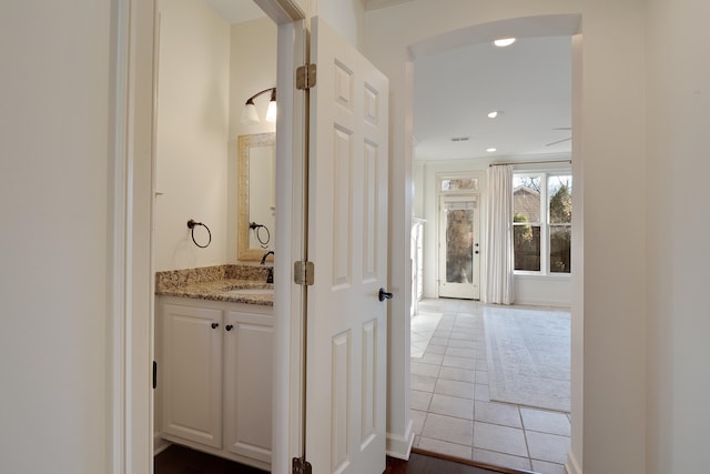 bathroom with tile patterned flooring and vanity