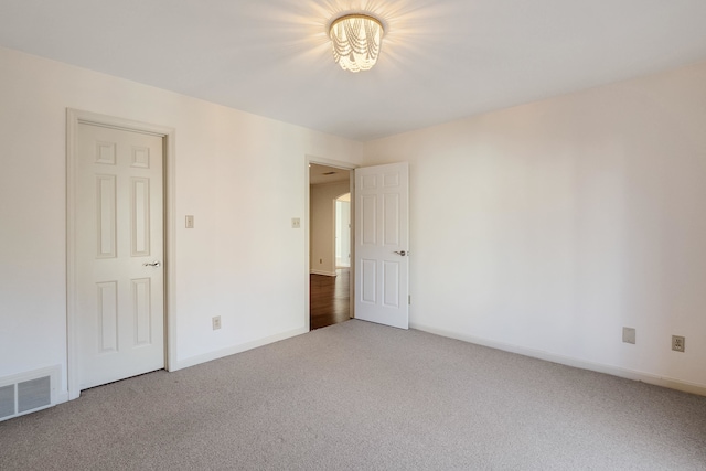 unfurnished room with carpet floors