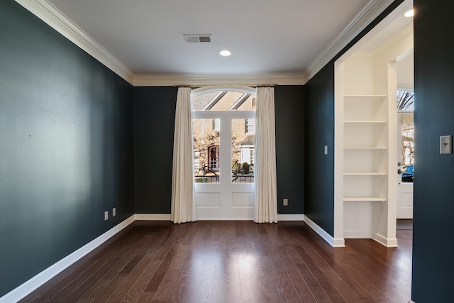 unfurnished room with ornamental molding and dark wood-type flooring