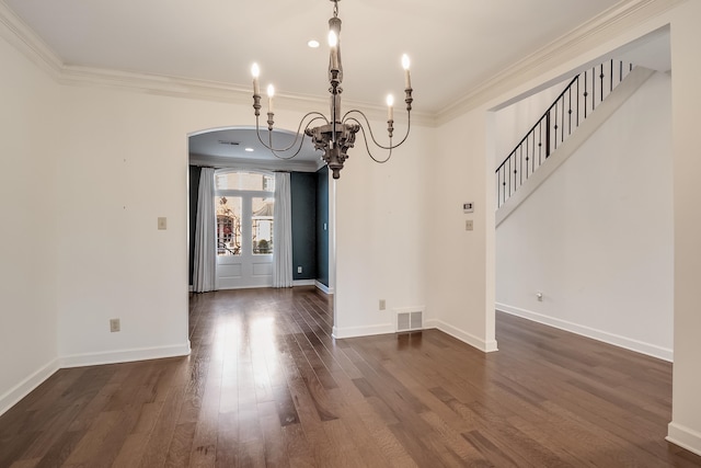 unfurnished dining area with ornamental molding, dark hardwood / wood-style flooring, and a chandelier