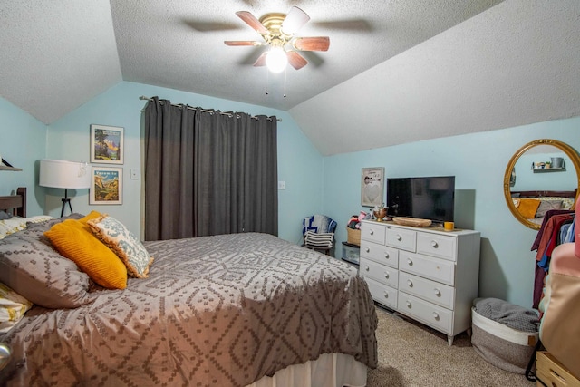 bedroom featuring lofted ceiling, ceiling fan, light colored carpet, and a textured ceiling