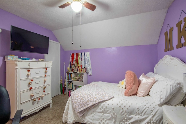 bedroom with ceiling fan, light colored carpet, a textured ceiling, and lofted ceiling