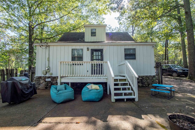 back of house with a patio