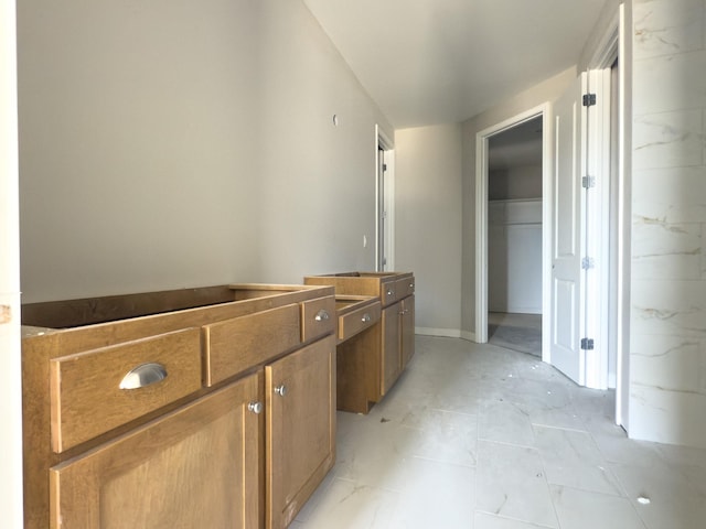 bathroom with marble finish floor and vanity