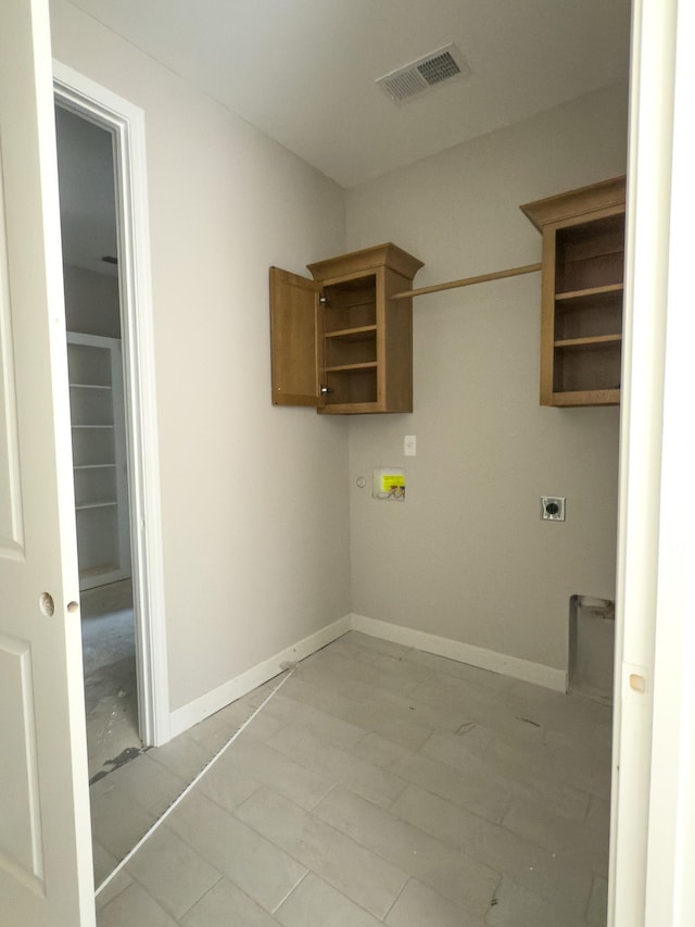 washroom featuring baseboards, laundry area, visible vents, and hookup for an electric dryer