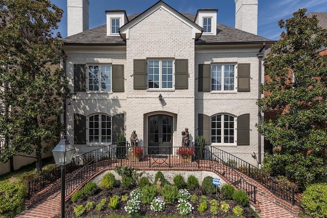 1911 Hazelton Dr, Germantown, TN 38138 - view of front of house featuring brick siding, stairway, a chimney, and a shingled roof