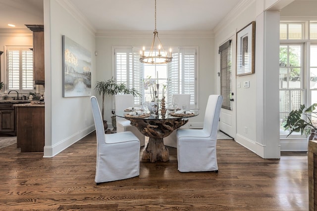 dining space with a notable chandelier, dark hardwood / wood-style floors, ornamental molding, and a wealth of natural light