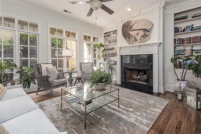 1911 Hazelton Dr, Germantown, TN 38138 - living area with a wealth of natural light, visible vents, built in shelves, a ceiling fan, and crown molding