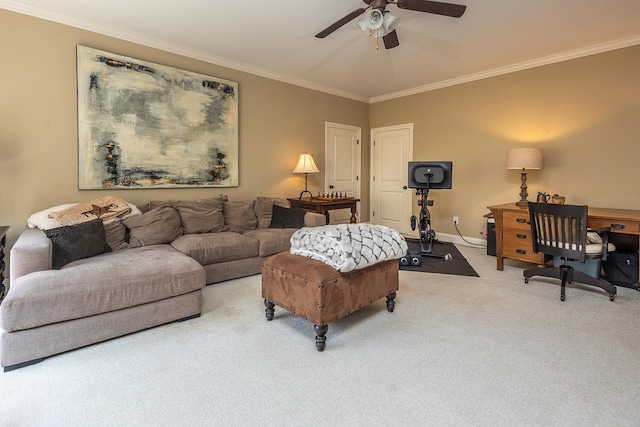 living room with carpet, crown molding, and ceiling fan